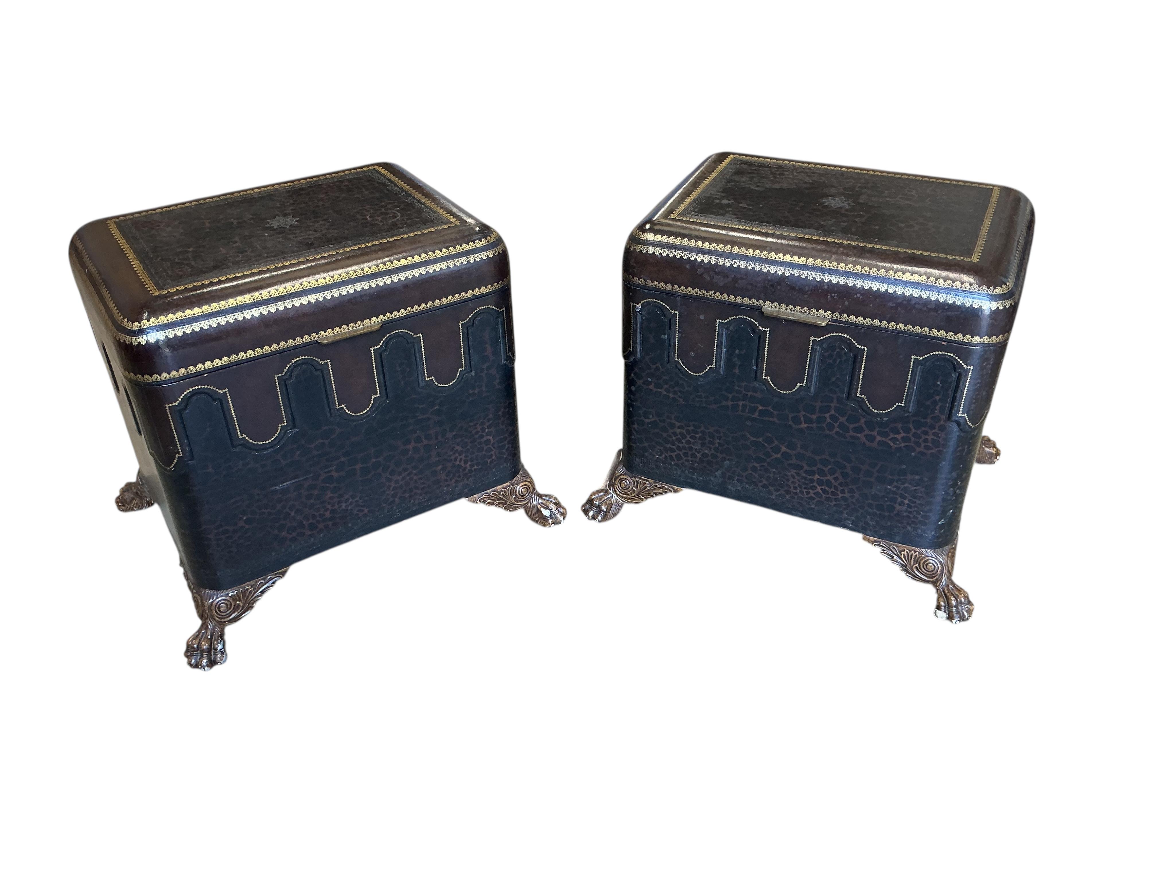 A pair of Contemporary Maitland Smith leather covered, leopard print trunks on lions paw feet, width 74cm, depth 58cm, height 60cm